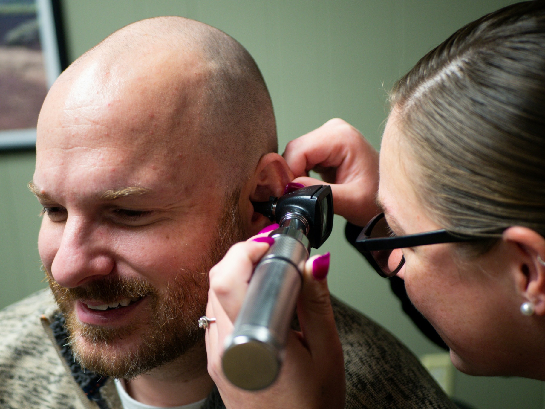 Patient wearing audiometry headphones during a hearing test
