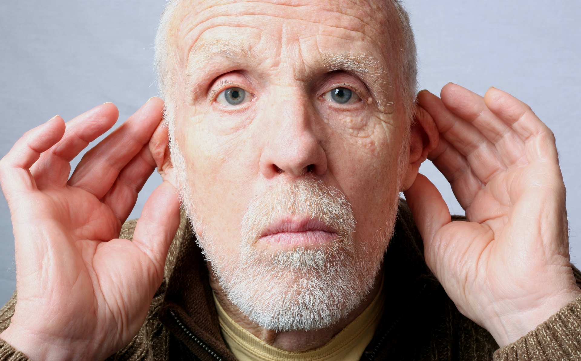 Woman straining to hear conversation