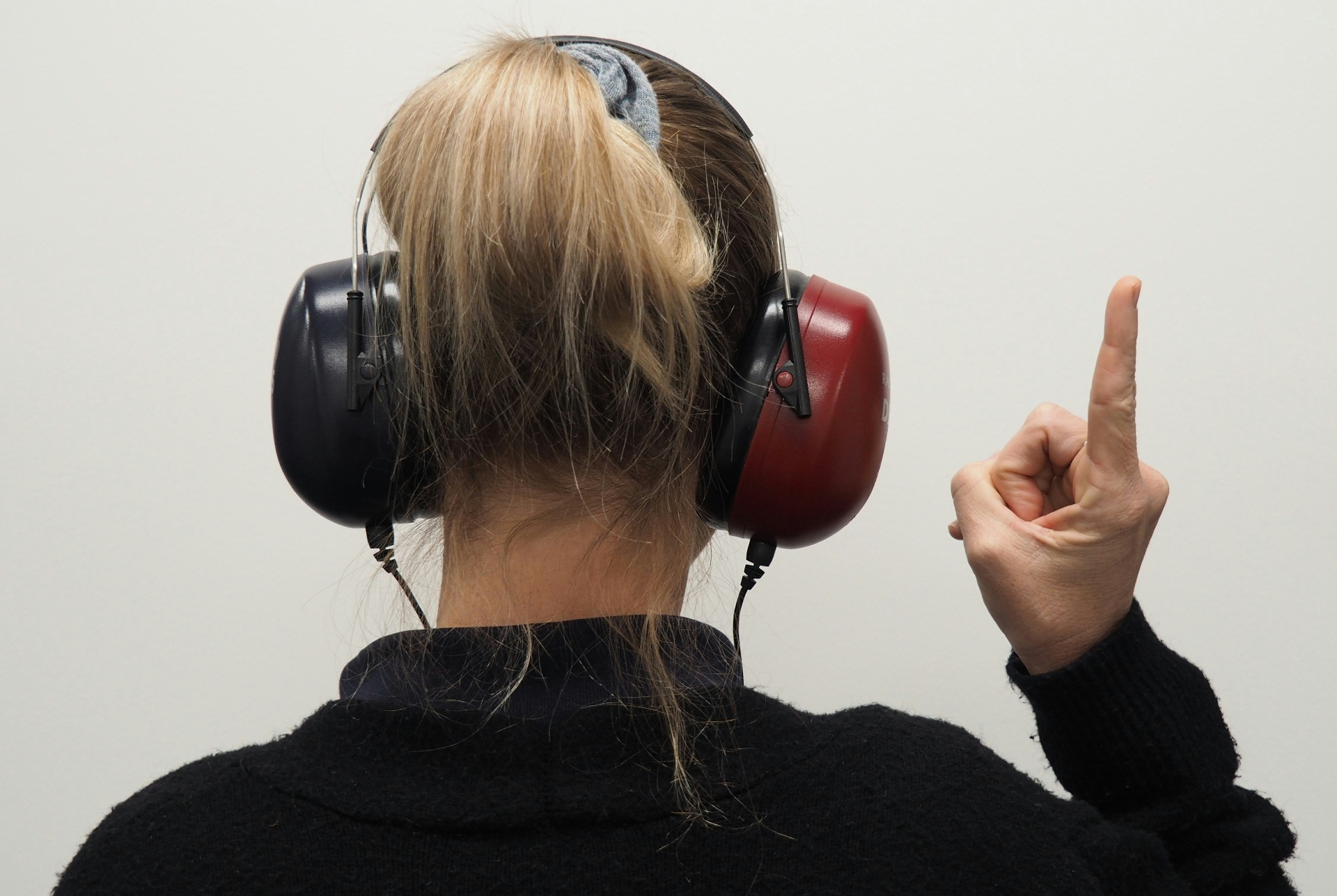 Audiologist performing a hearing test and ear examination